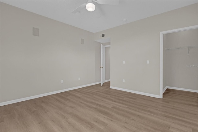 unfurnished bedroom with light wood-type flooring, visible vents, and baseboards