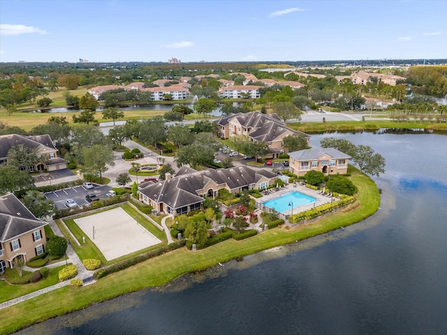 birds eye view of property with a water view