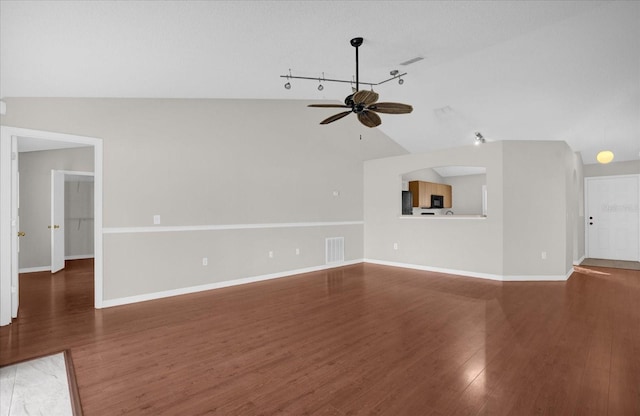 unfurnished living room with lofted ceiling, ceiling fan, and dark hardwood / wood-style floors