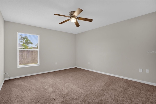 empty room featuring carpet and ceiling fan