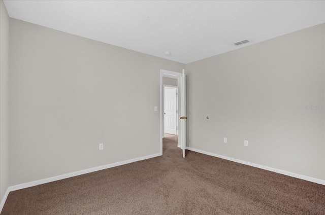 unfurnished room with carpet floors