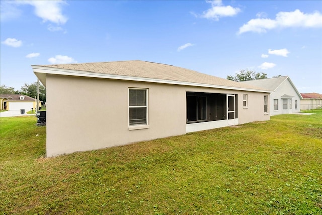 back of house with a yard