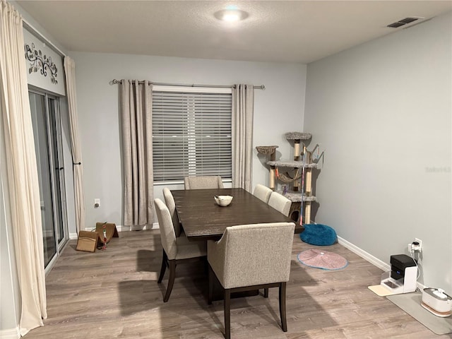 dining area featuring hardwood / wood-style flooring