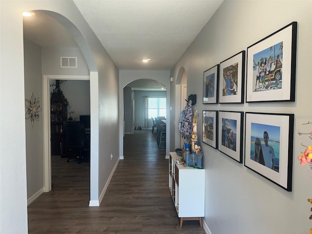 hall featuring dark wood-type flooring