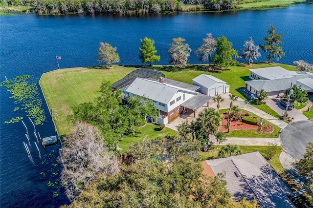 birds eye view of property with a water view