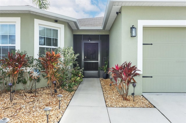 view of exterior entry featuring a garage