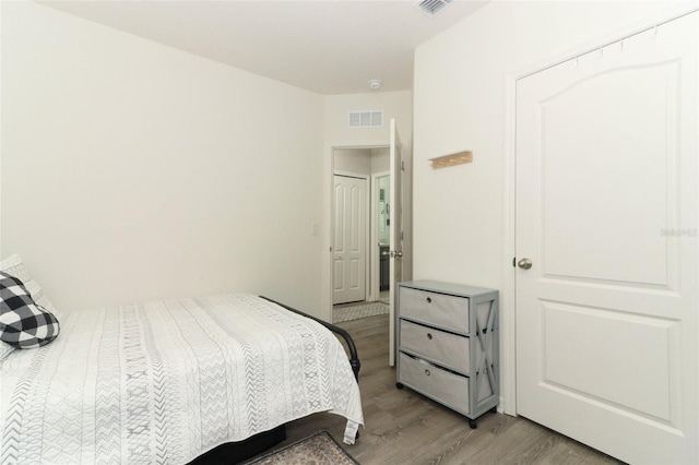 bedroom with light hardwood / wood-style flooring