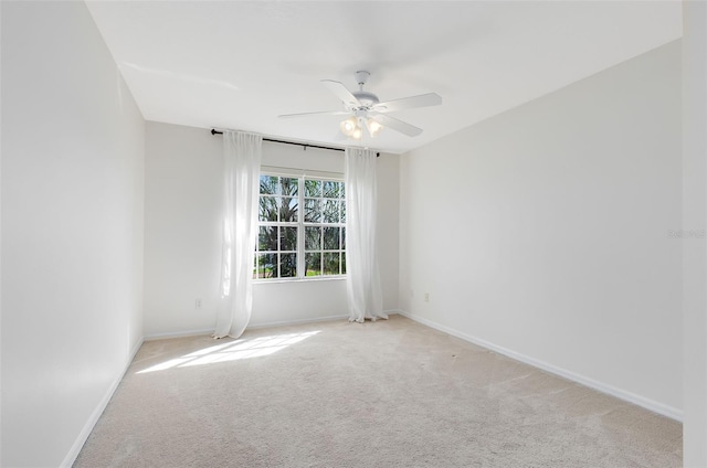 empty room with light carpet and ceiling fan