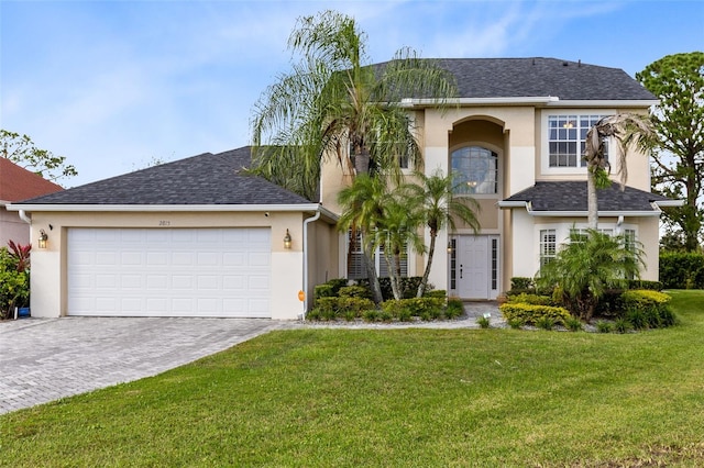 view of front facade featuring a front lawn and a garage