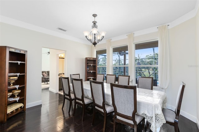 dining room featuring dark hardwood / wood-style floors and ceiling fan with notable chandelier