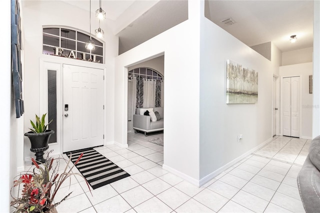 entryway featuring light tile patterned floors