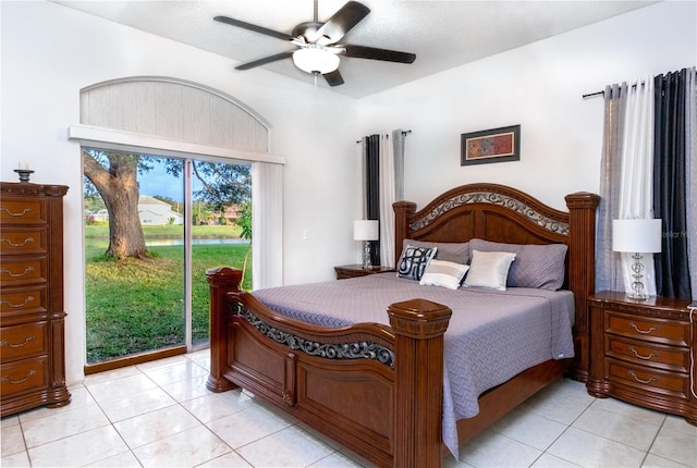 tiled bedroom with access to exterior and ceiling fan