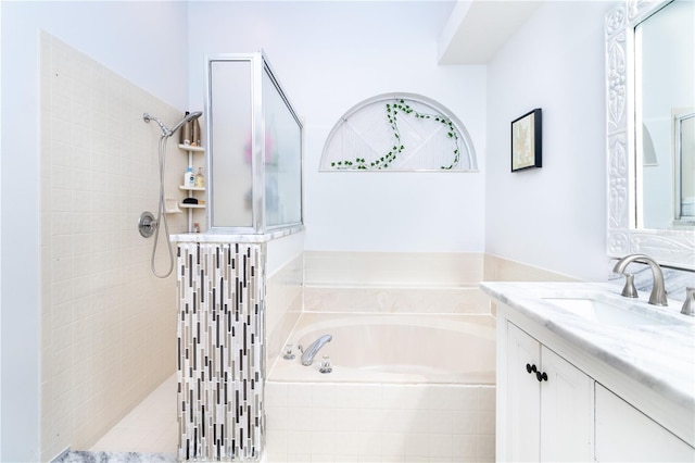 bathroom featuring separate shower and tub and vanity