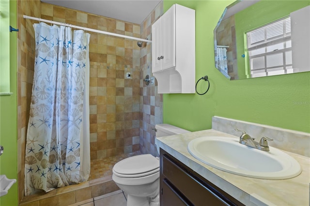 bathroom featuring toilet, vanity, a shower with shower curtain, and tile patterned flooring