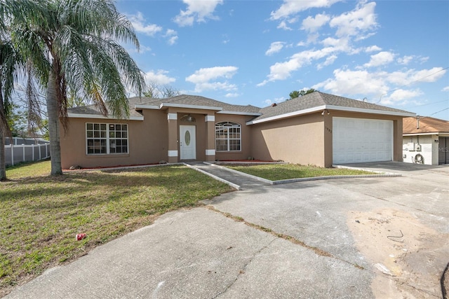 view of front of home featuring a garage and a front lawn