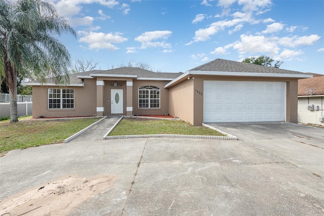 view of front of house featuring a garage and a front yard