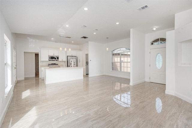 entrance foyer featuring a textured ceiling and sink