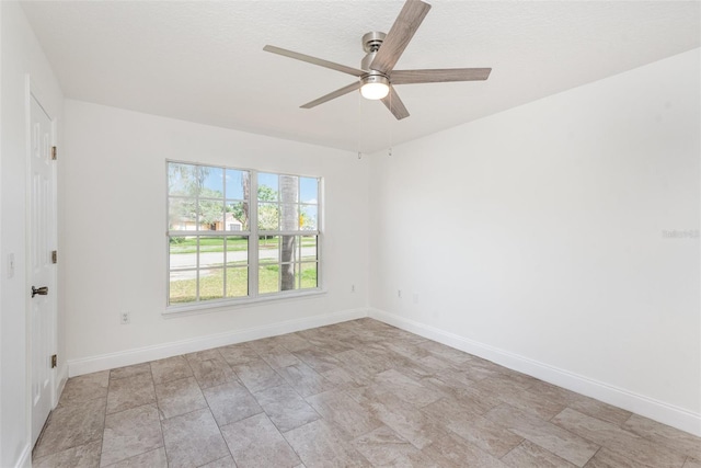 spare room with ceiling fan