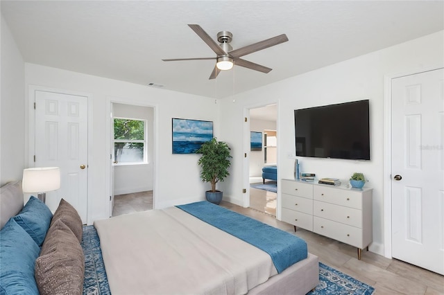 bedroom with connected bathroom and ceiling fan