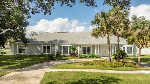 single story home with a front yard