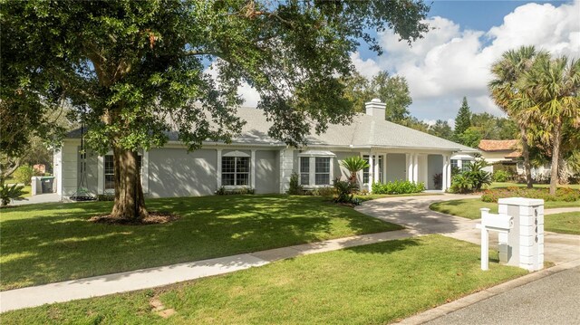 single story home with a front yard