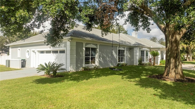 exterior space with a lawn and a garage