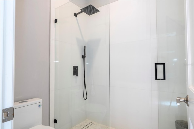 bathroom with toilet and walk in shower