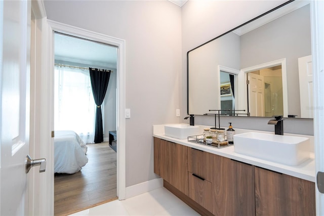 bathroom with vanity and wood-type flooring