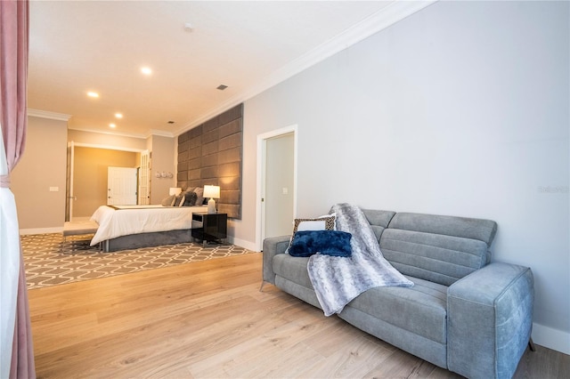 bedroom with hardwood / wood-style floors and ornamental molding