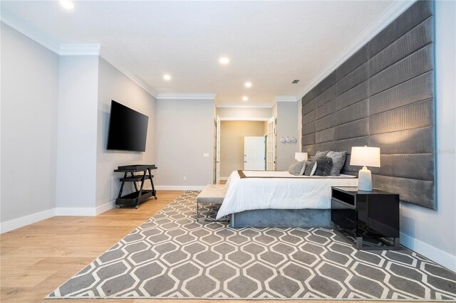 bedroom with wood-type flooring and ornamental molding