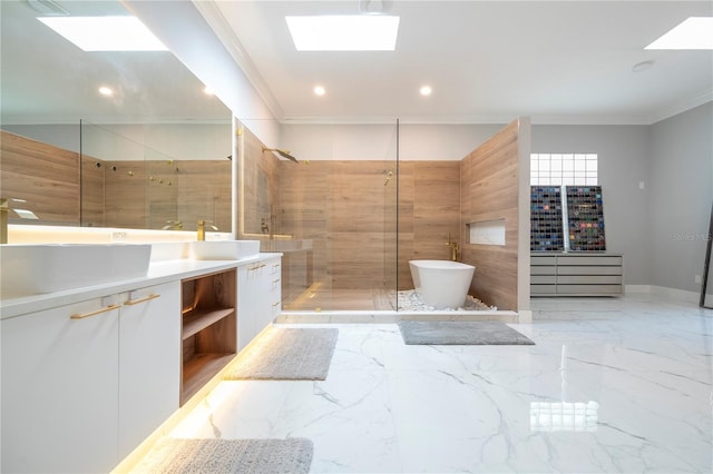 bathroom featuring a skylight, plus walk in shower, vanity, and ornamental molding