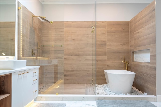 bathroom featuring vanity and independent shower and bath