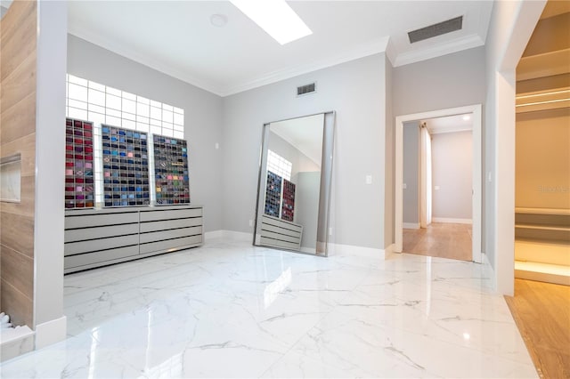 empty room featuring hardwood / wood-style flooring and crown molding