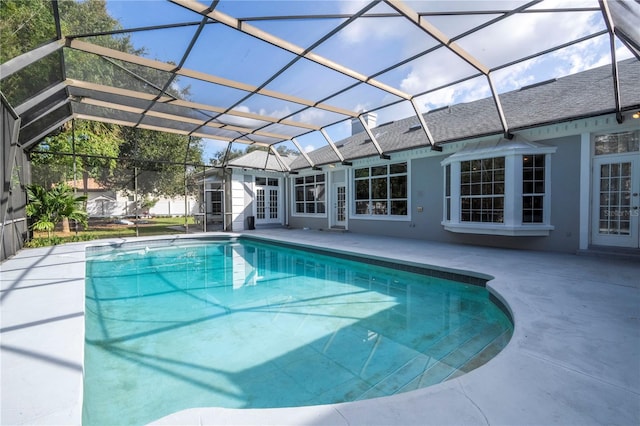 view of pool featuring french doors, a patio, and a lanai