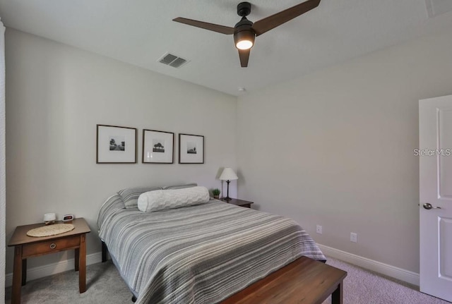 bedroom featuring light carpet and ceiling fan