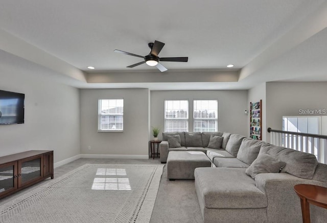 carpeted living room featuring ceiling fan