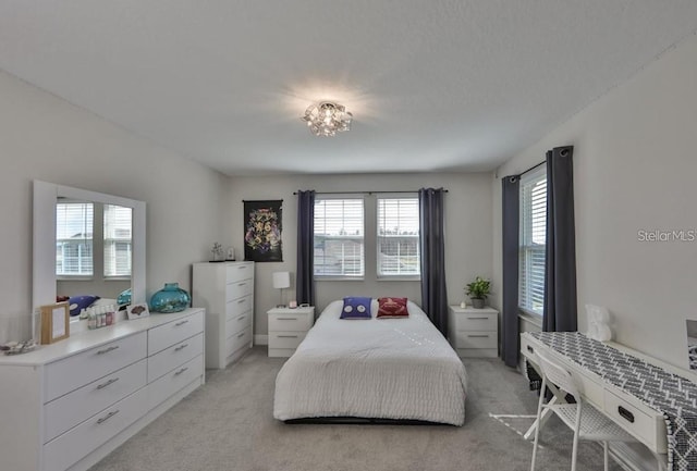 bedroom featuring light colored carpet