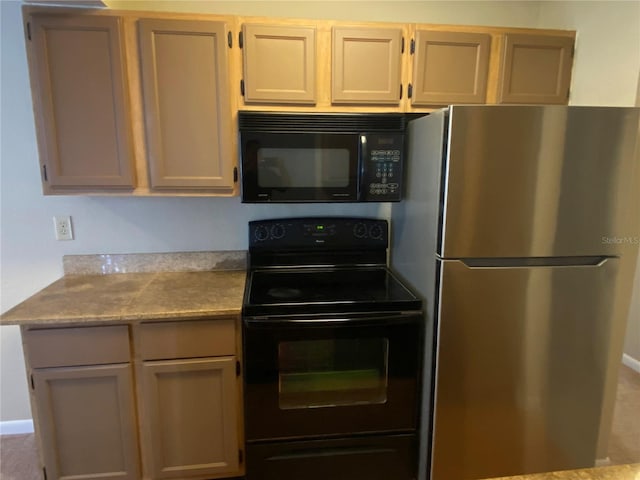 kitchen with black appliances and light brown cabinets