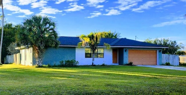 single story home featuring a front lawn and a garage