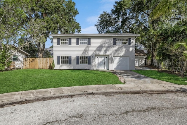 view of front of house featuring a front lawn and a garage