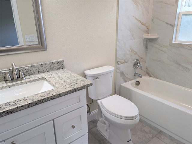 full bathroom with vanity, tiled shower / bath combo, and toilet