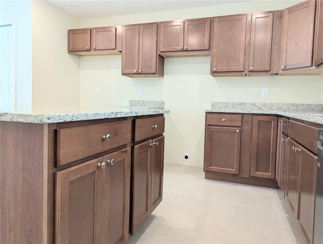 kitchen with light stone countertops