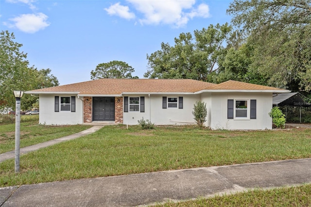 ranch-style house featuring a front lawn