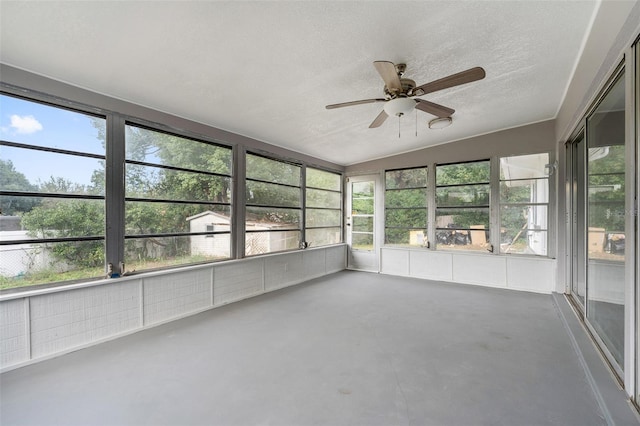 unfurnished sunroom featuring lofted ceiling and ceiling fan