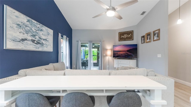 living room featuring light wood-type flooring and ceiling fan