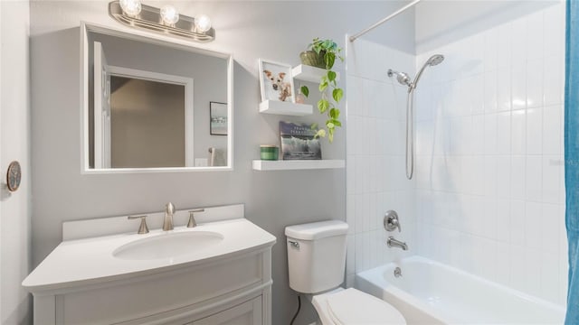 full bathroom featuring vanity, toilet, and tiled shower / bath combo