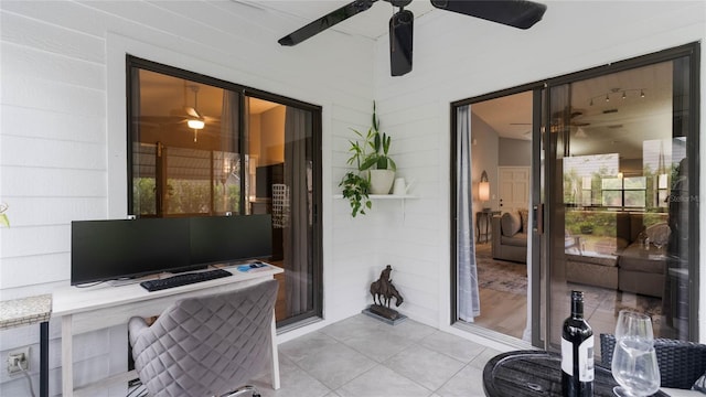 tiled home office featuring washer / clothes dryer and vaulted ceiling