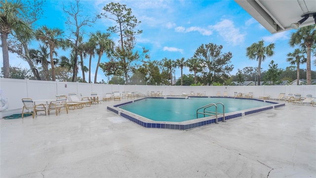 view of swimming pool featuring a patio area