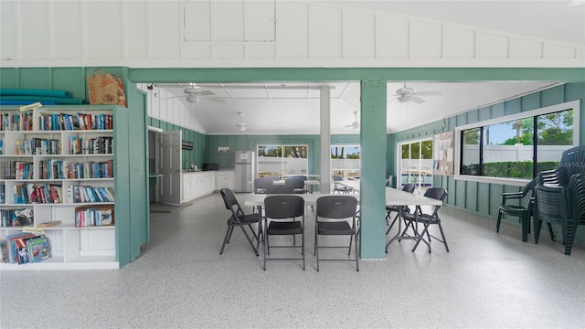 dining room with ceiling fan and lofted ceiling