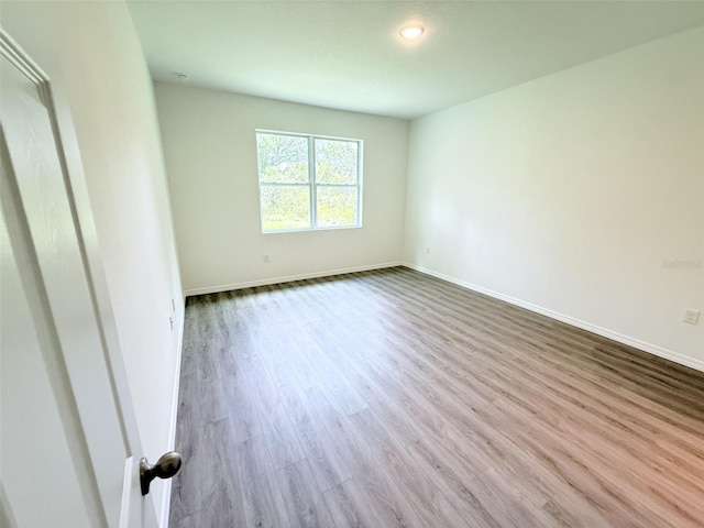 1294 Napoleon Rd, North Port, FL 34288 - spare room featuring wood finished floors, baseboards, and recessed lighting